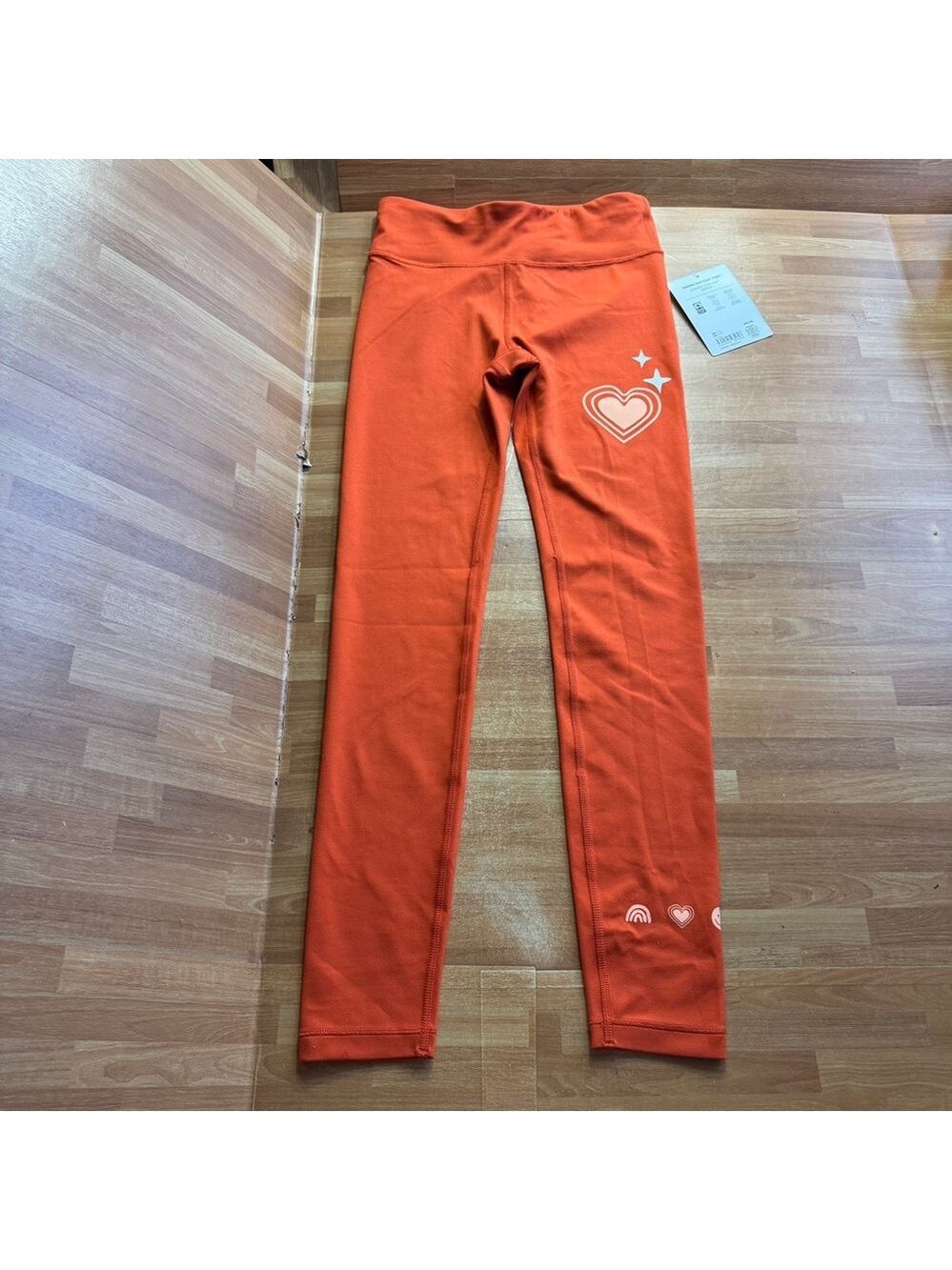 Athleta girl Simone chit chat tight leggings size 12 orange NWT